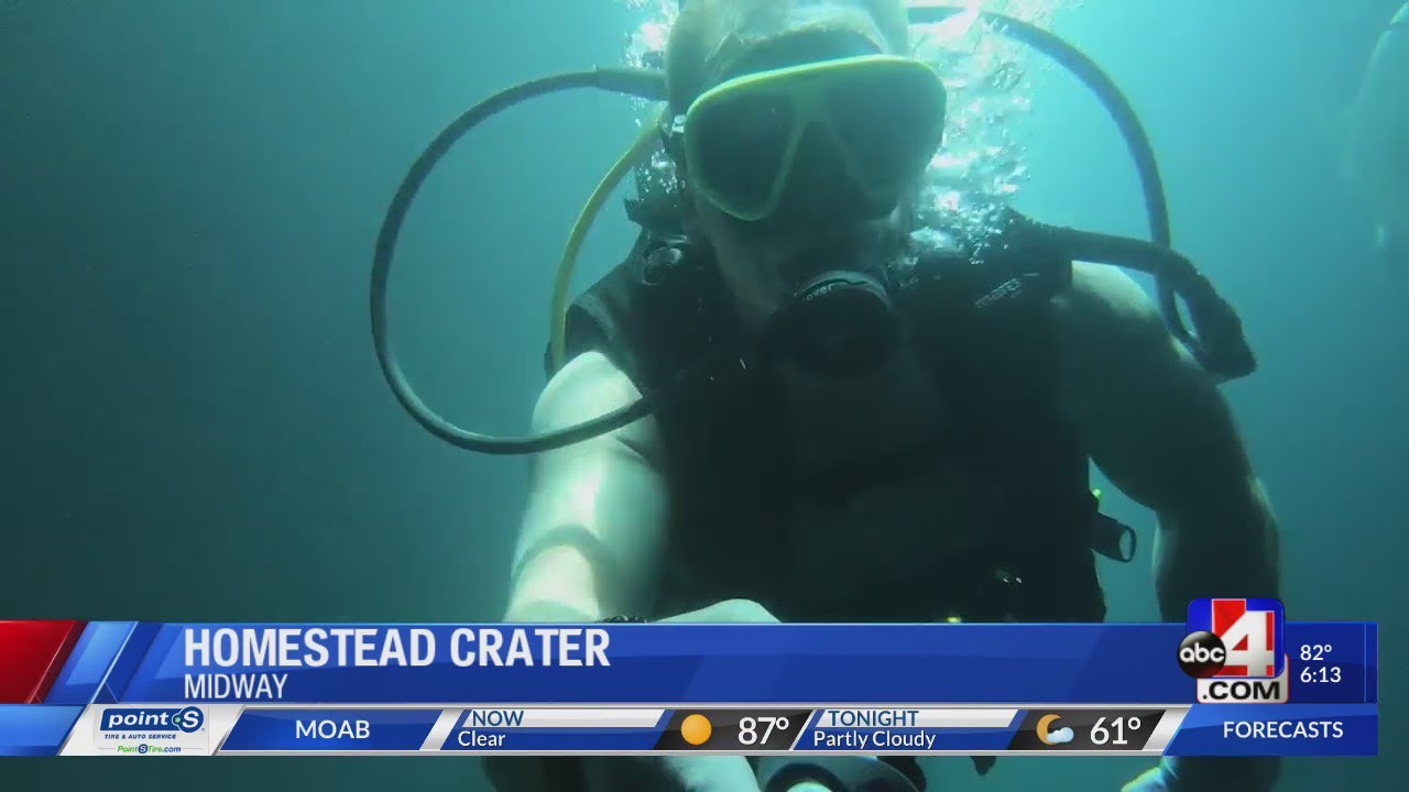 Diving into the warm water at the Homestead Crater in Midway, Utah