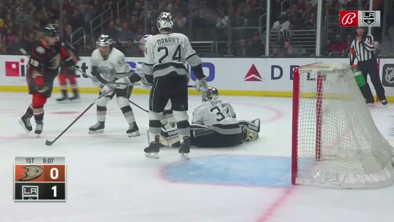 Jonathan Quick makes a save on Ryan Getzlaf after Sean Durzi coughs up the puck.