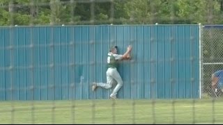 Center fielder holds on despite crashing into wall