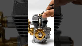 engine with cooling fins and gold-toned components on a white surface. #facts #story #shorts