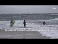 Surfers catch waves at Delaware Seashore State Park