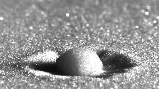 Raindrop Impact on a Sandy Surface