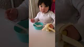 Evan&#39;s eatting rice in water and banana.