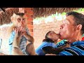 Monkey baby cuddle with super cute grandpa