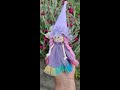 Adorable purple fairy doll in a cap