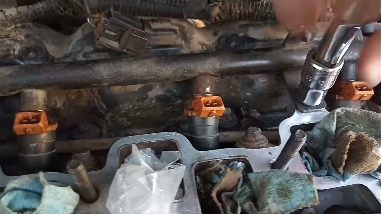 1998 Plymouth Voyager 3.3 L injector seal replacement part 2 - YouTube
