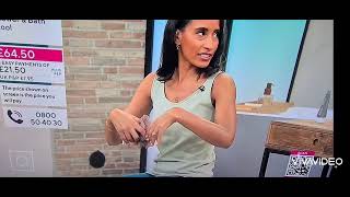 QVC UK presenter Cordelia demos foot product.