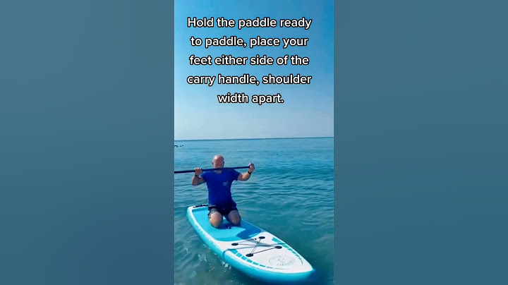 How to stand up on a paddleboard #paddleboard #paddleboarding #learntopaddleboard #howtopaddleboard