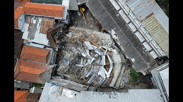 Rescuers run oxygen to survivors in Indonesia school building collapse that buried dozens