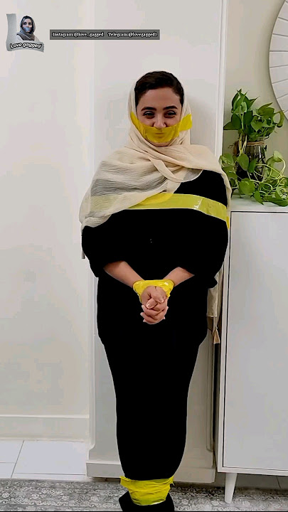persian woman yellow tape gagged