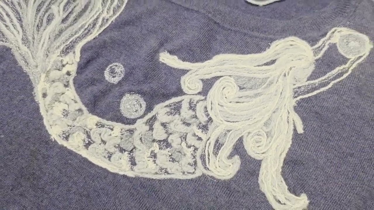 Freestyle embroidery and couching mix of a mermaid design.