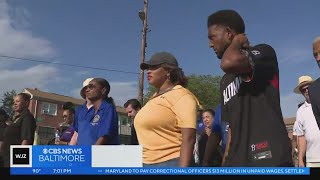 Baltimore mayor, police commissioner lead crime walk through Brooklyn after mass shooting