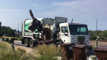 Bay disposal and recycling Peterbilt 320 Labrie automizer garbage truck on cart lines