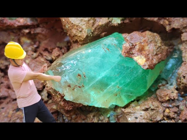 Diamonds and emeralds emerge from crevices in rocks after torrential rain class=