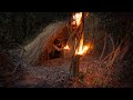 Building complete and warm survival shelter  Bushcraft earth hut, grass roof & fireplace with clay