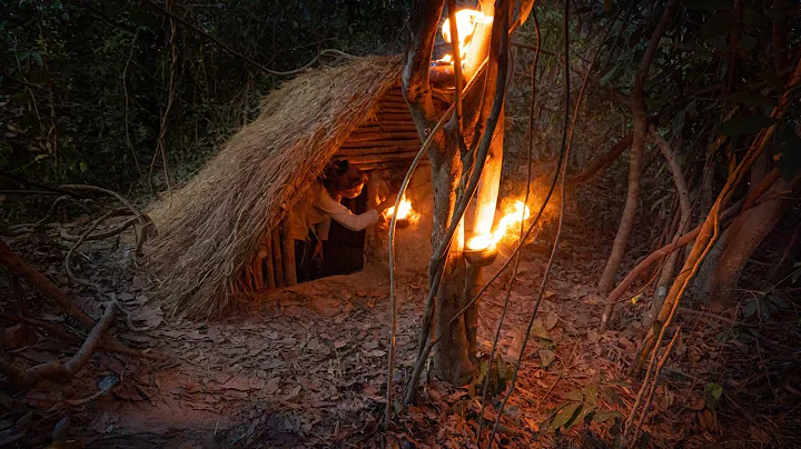 Building complete and warm survival shelter  Bushcraft earth hut, grass roof & fireplace with clay