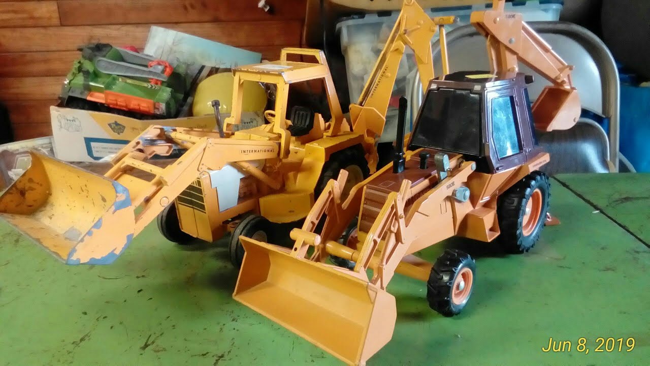 Old Vs. New Ertl Backhoe - YouTube