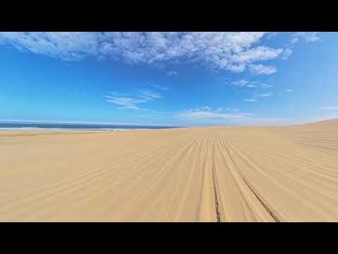 Sandwich Harbour Tour Namibia through the dunes and onto the beach.