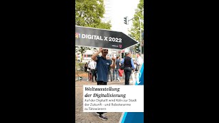 Auf der DigitalX wird Köln zur Stadt der Zukunft - und Roboterarme zu Tätowierern