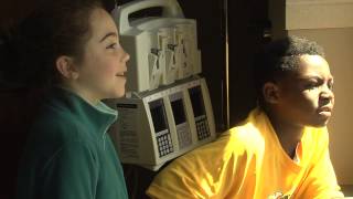 Superheroes wash windows at Our Lady of the Lake Children's Hospital