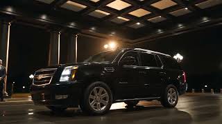 agent generate video   Motorcade arrival at a venue  night  An armored black SUV st