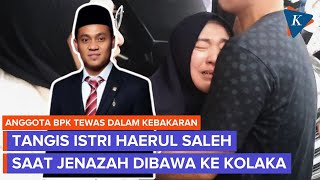 The wife of BPK member Haerul Saleh cries after her husband died in a house fire.