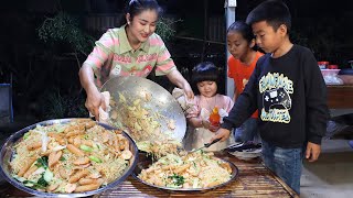 Happy time eating stir-fry noodle with hot dog - Mother and children cooking