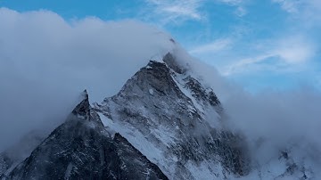 Clouds passing over mountains - relaxing mountain video