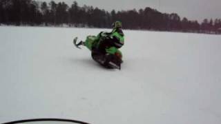 Snowmobile Balancing On One Ski
