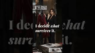 AI creative director in a dark luxury fashion showroom