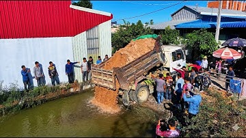 Extreme work landfill full project ! team truck unloading with bulldozer komatsu d20p push soil