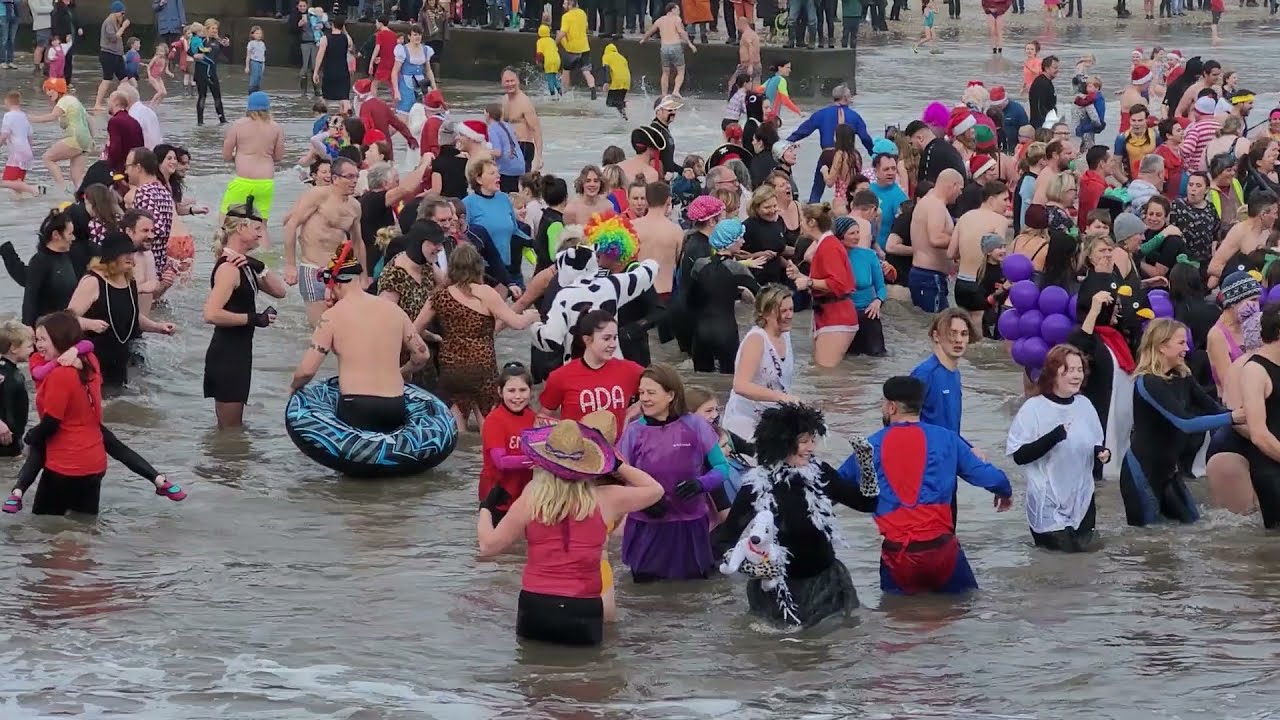The Lyme Lunge 2022, Dorset's popular New Years Day fancy dress charity swim held in Lyme Regis.