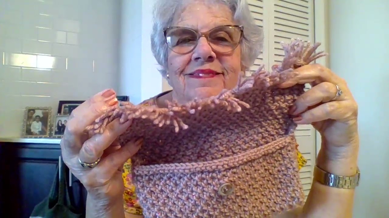 Carterita de mano tejidas a dos agujas.