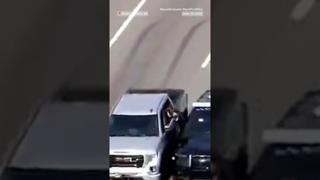 Police climb through a car window to rescue driver during medical emergency Police climb through a car window to rescue driver during medical emergency
