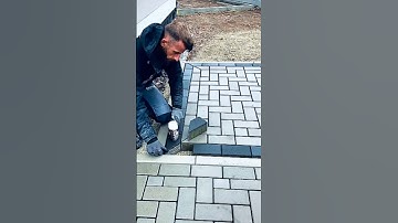 This man is installing paving blocks in the corner.#shorts #construction #shortvideo