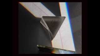 Prismatic spectra and the light/dark symmetry