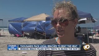 Thousands pack local beaches to beat the heat