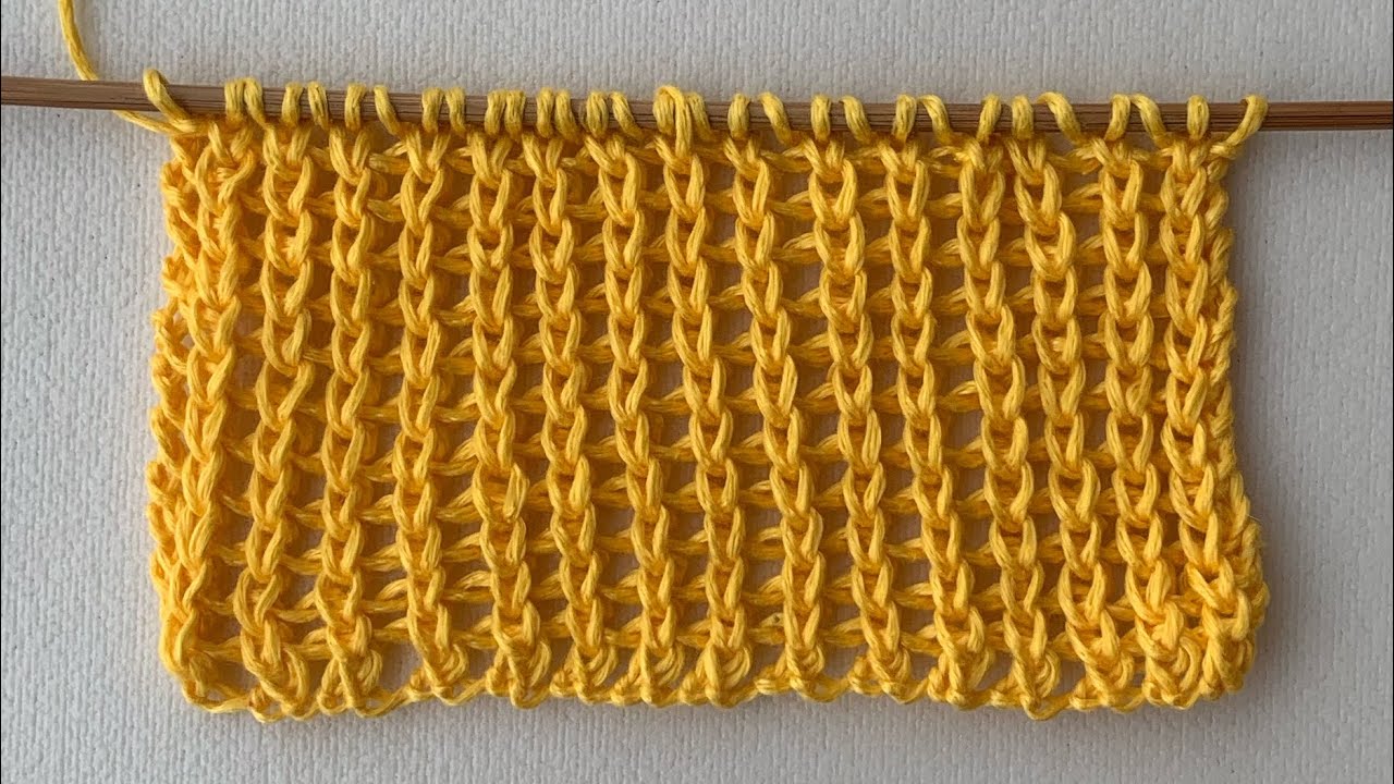 Punto traforato a catenelle Tutorial a maglia semplice. Due giri.