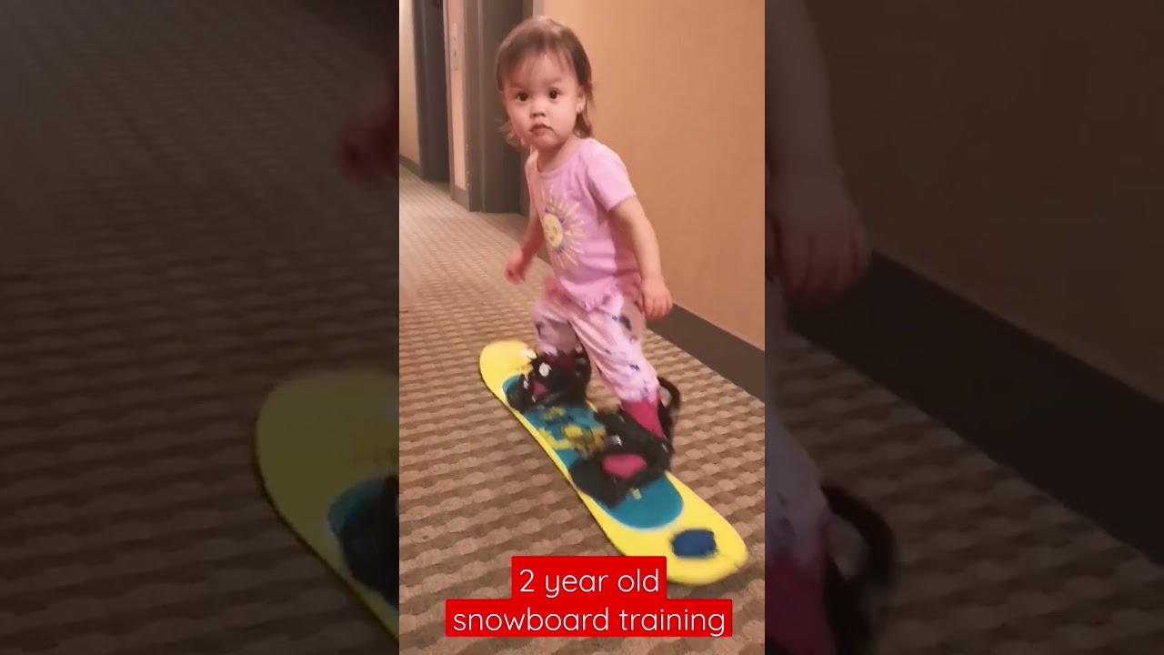 2yr old learns snowboarding 