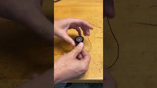 Light a bulb with a battery and one wire