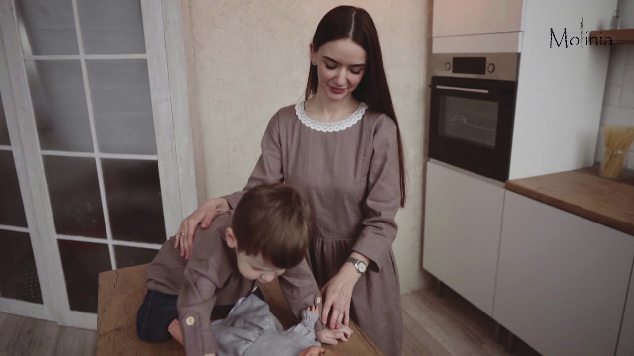 Linen latte shirt for boys with sleeves on the chopping block.
