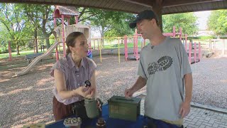 Bret explains different geocache containers and “tools of the trade” to Ana | Around Town