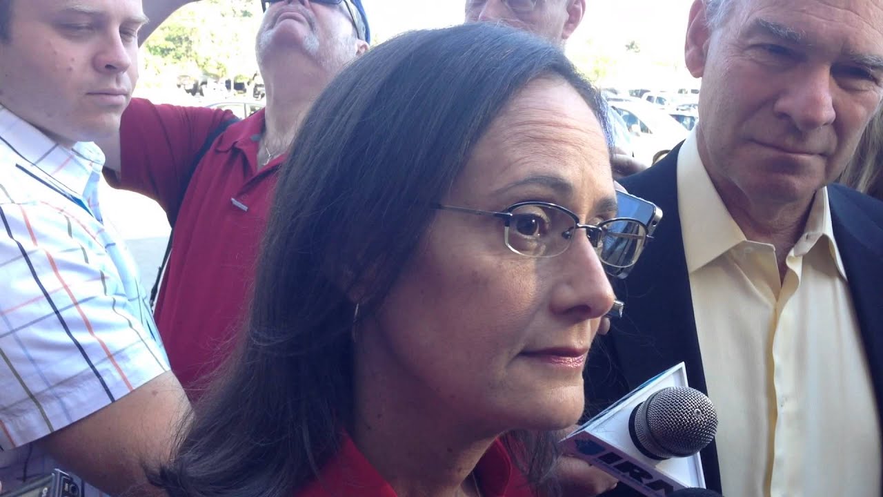 Attorney General Lisa Madigan speaks briefly to reporters Wednesday.