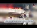 تفاصيل غير متوقعة لشاب يجلس على سور بلكونة الجيران أثناء احتراق شقته