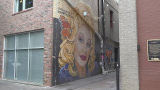 Vandals strike Dolly Parton mural in Strong Alley again, but repairs are swift