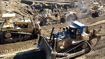 CAT D10N and D9L Dozers pushing 651B  scrapers - D10T ripping rock and dirt
