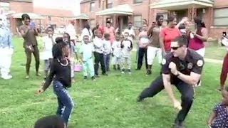Watch Police Office Challenge Residents To Dance-Off While On Patrol