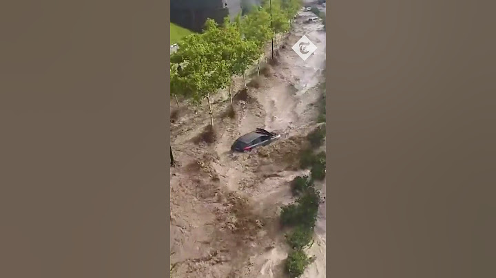 Dramatic moment severe flooding sweeps cars away in Spain