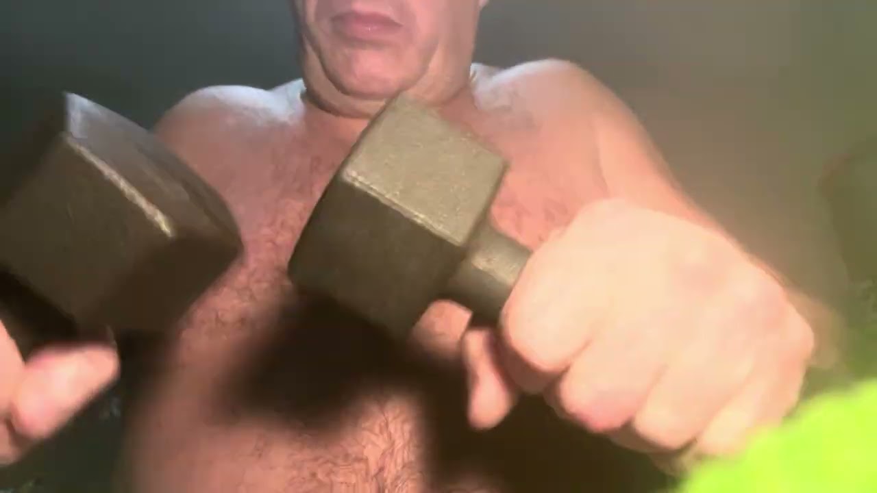 The absolutely massive Batman works out his broad hairy chest while very close to you 