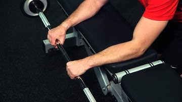Palms-Down Wrist Curl Over A Bench